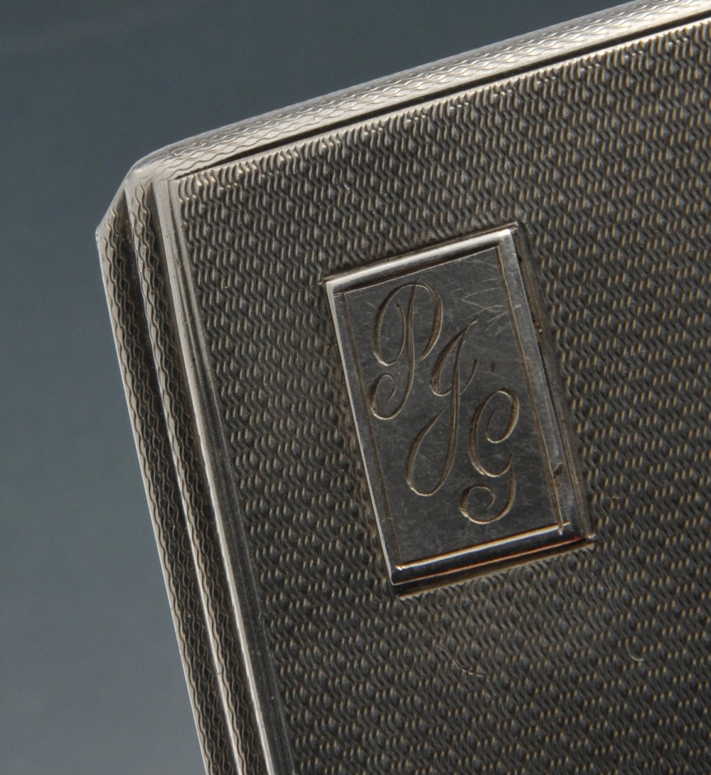 A mid-twentieth century silver cigarette case of rounded rectangular form, having stepped sides, - Image 4 of 11