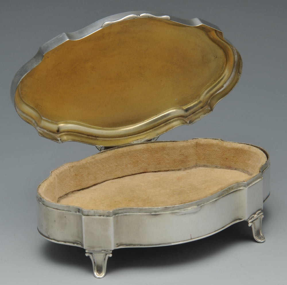An early twentieth century silver mounted trinket box of shaped oval outline and raised on four - Image 2 of 15