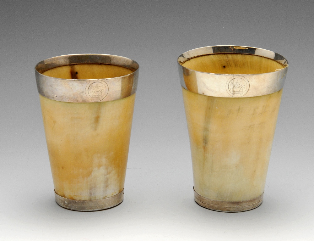 Two similar mounted horn beakers of tapered form with banded mounts engraved crest and