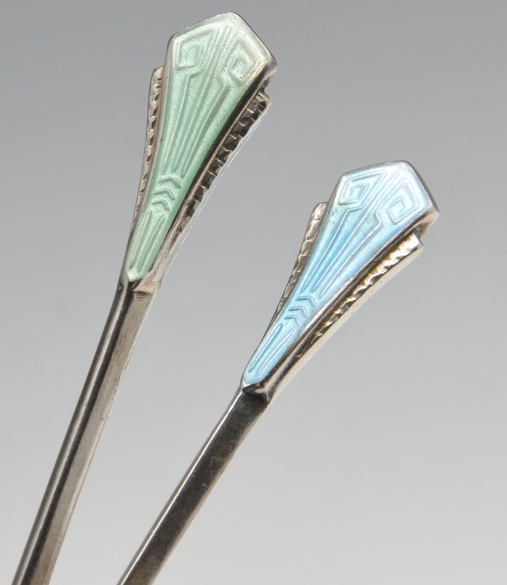 A cased set of Art Deco enamelled coffee spoons, the faceted bowls with shaped shoulders rising to - Image 2 of 4