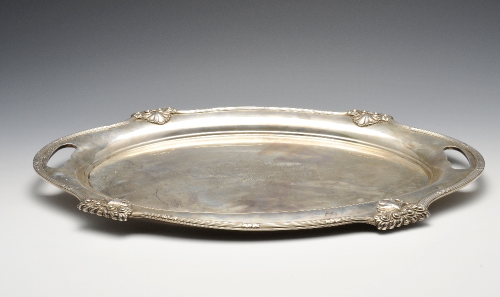 An early to mid-twentieth century silver tray, the oval body with central presentation inscription