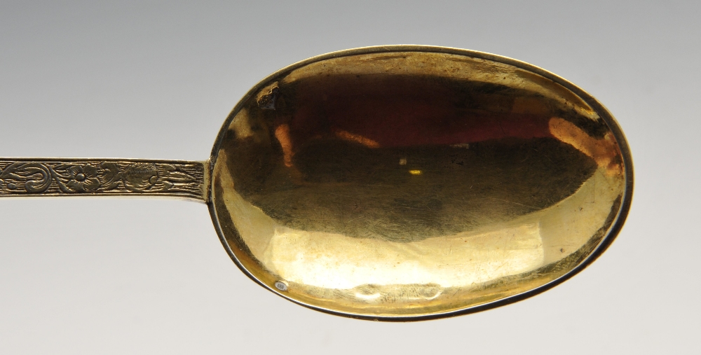 An Edwardian imported replica silver-gilt Trefid spoon with foliate engraved stem with stylised - Image 8 of 8