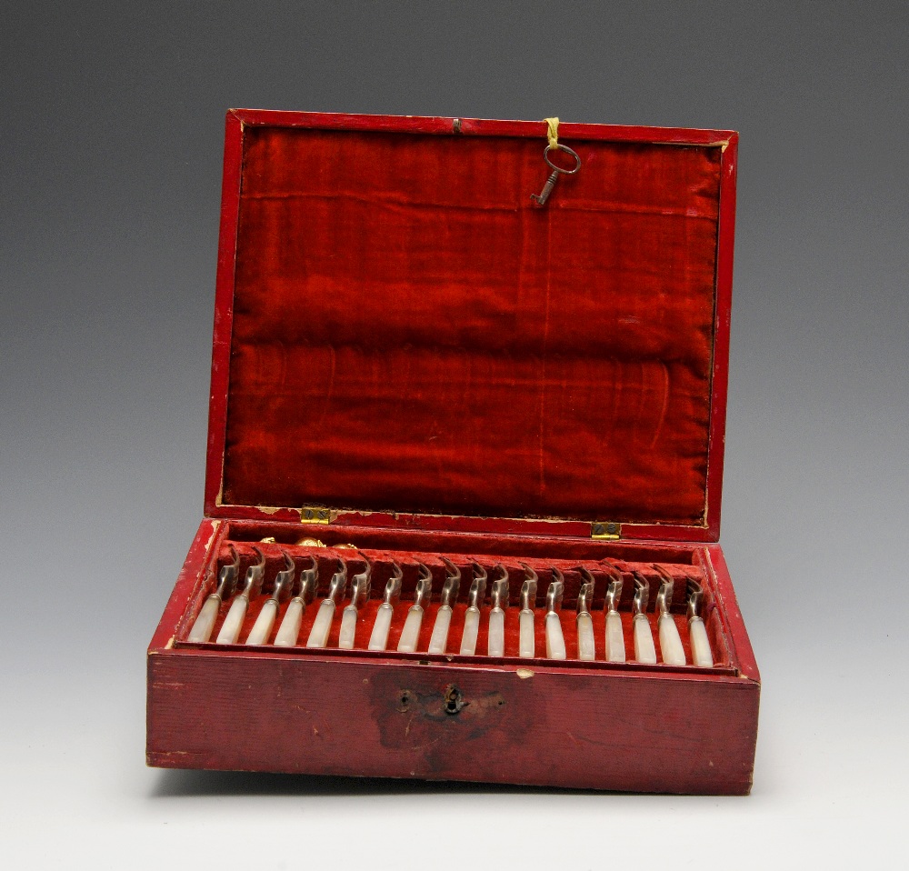 A George IV cased set of silver mounted fruit knives and forks for eighteen place settings and