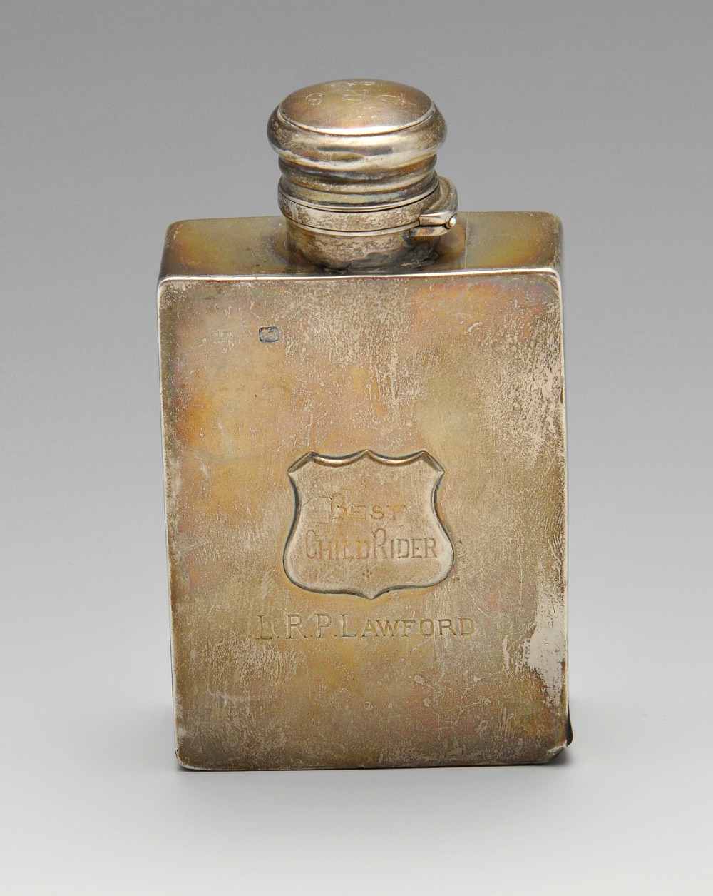 A Victorian silver hip flask, the oblong form with applied shield, personal inscription and hinged