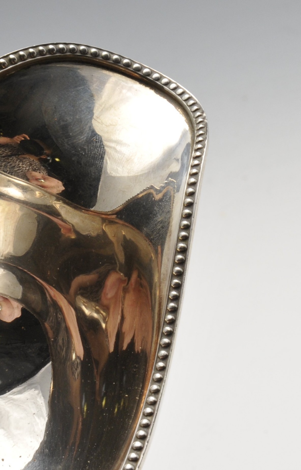 An early twentieth century silver sauce boat of typical form with ribbon and reed rim and raised - Image 5 of 6