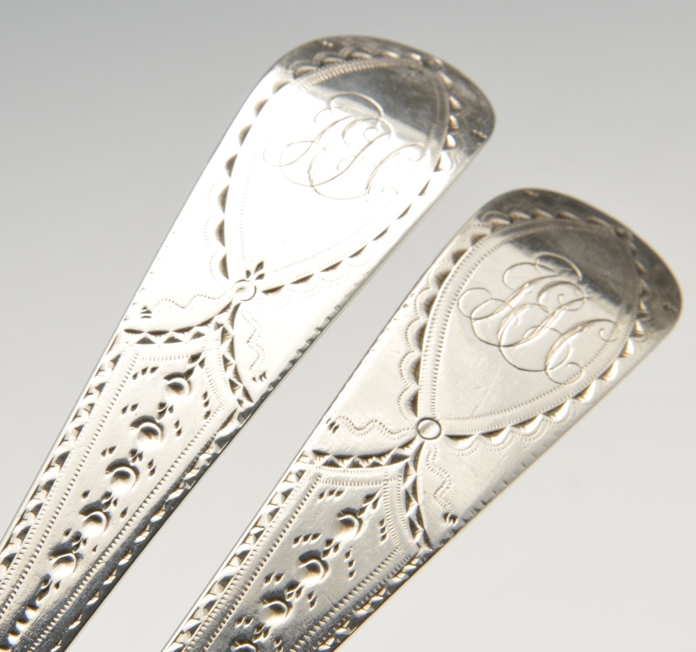 A pair of George III silver basting spoons in Old English pattern, each stem with bright-cut - Image 3 of 6