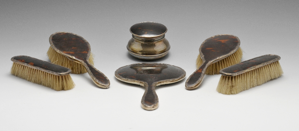 An early twentieth century five piece silver mounted tortoiseshell dressing table set comprising