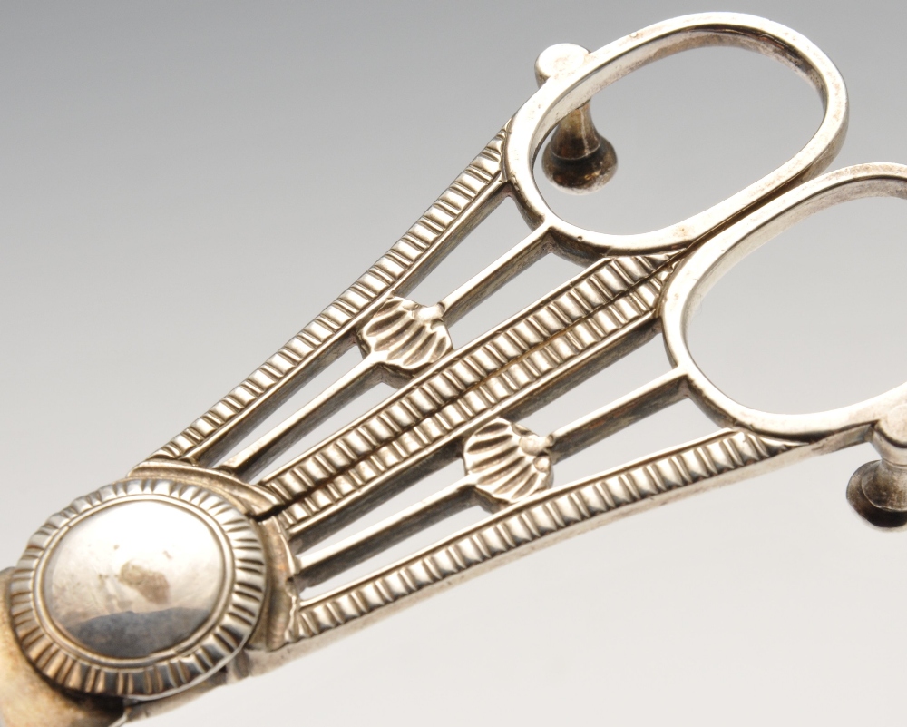 A late George III pair of silver candlesnuffers, the conventional scissor action form with gadroon - Image 3 of 3