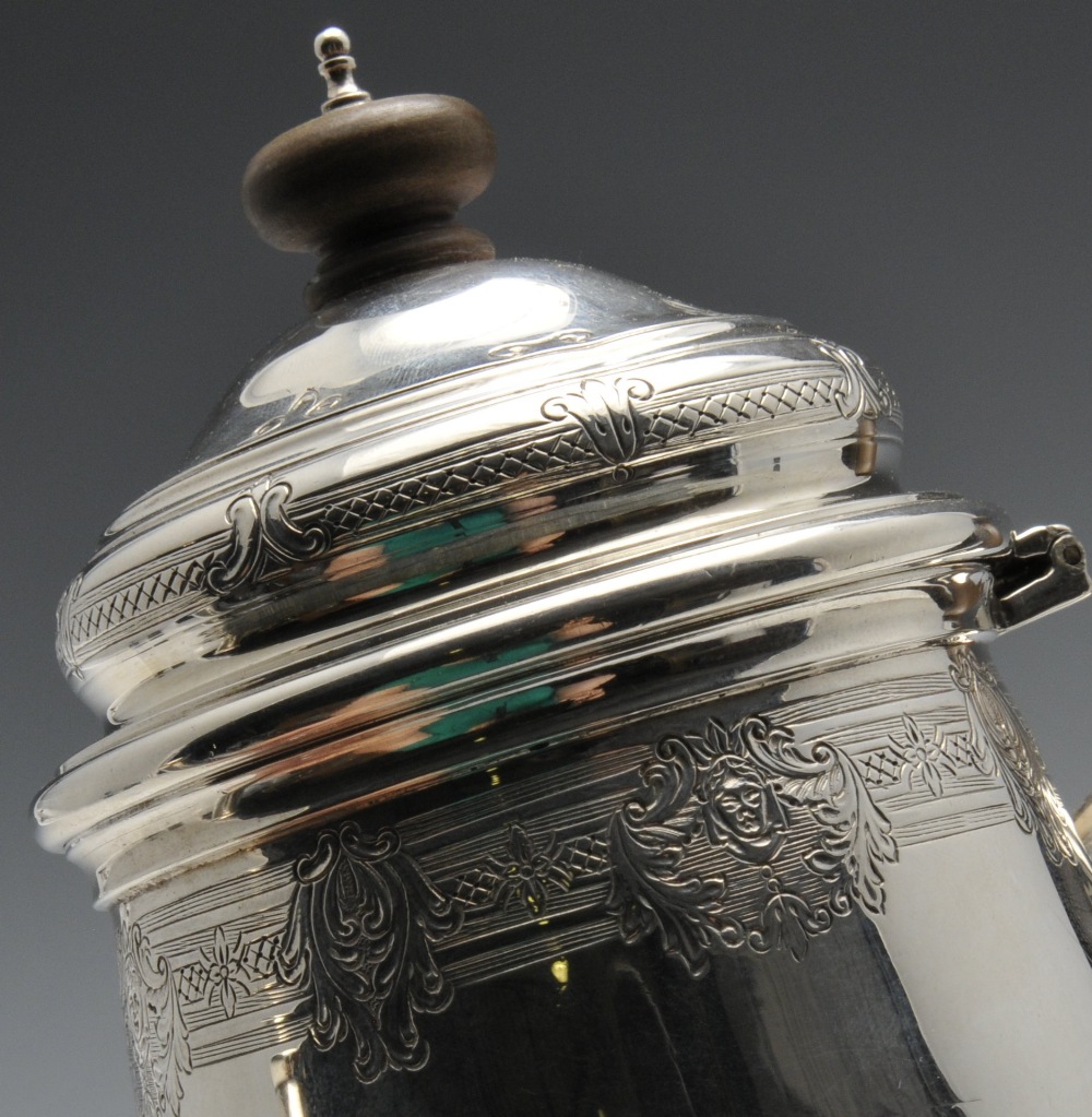 A 1920's silver coffee pot of plain tapered form, the rim and hinged cover embellished with a floral - Image 4 of 5