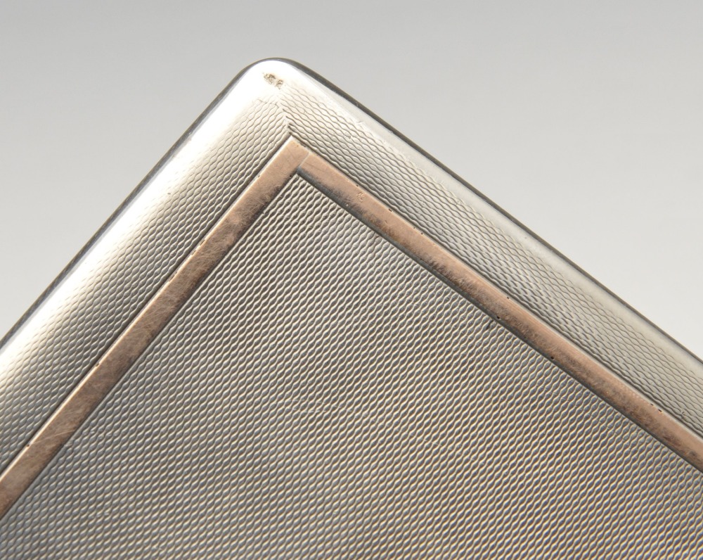 A 1930's silver cigarette case of oblong form with engine-turned decoration, gold tone border and - Image 5 of 5