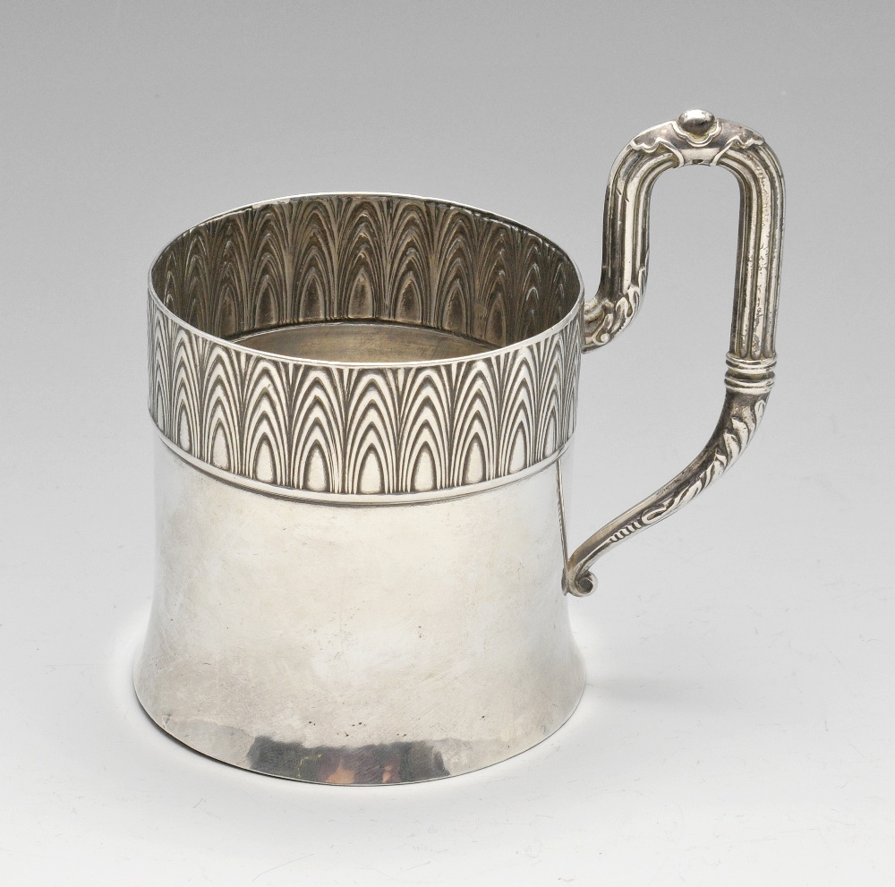 An early twentieth century Russian silver tea glass holder, the cylindrical body with flared foot