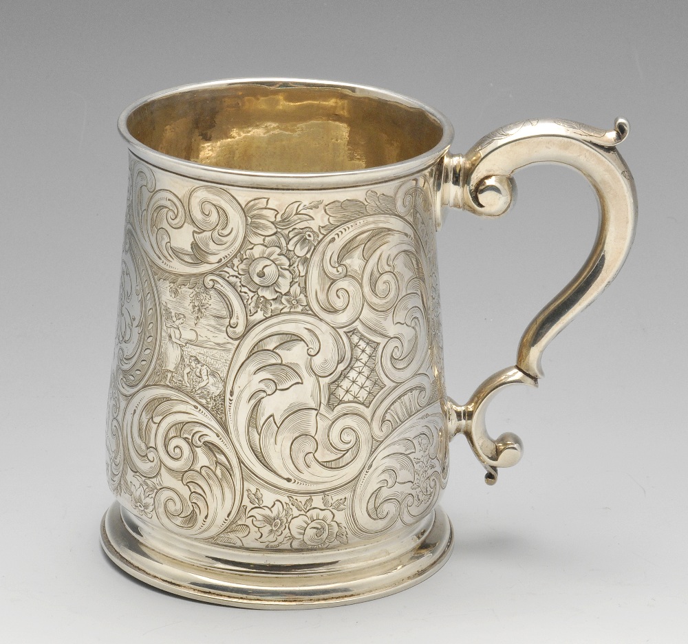 A George II silver mug, the tapered body with later floral scroll and scenic engraving surrounding