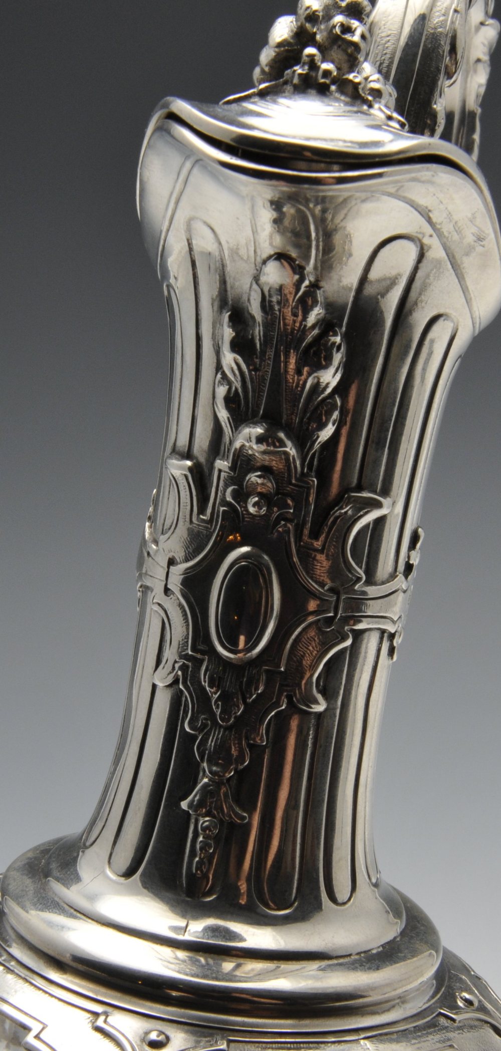 A French silver mounted claret jug, the segmented body overlaid with floral swags rising to the - Image 4 of 7