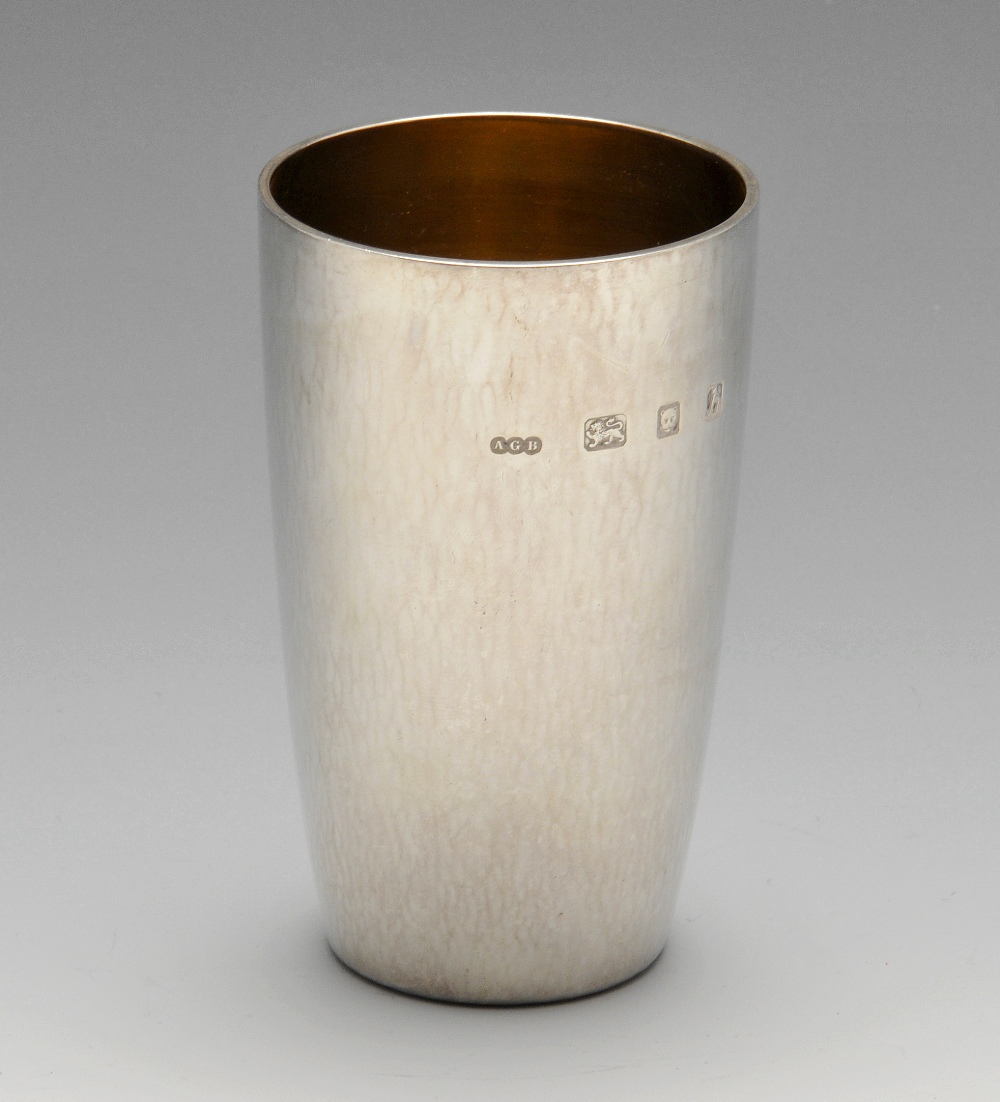 A 1960's silver beaker, of plain tapering form having a gilt interior. Hallmarked Gerald Benney,