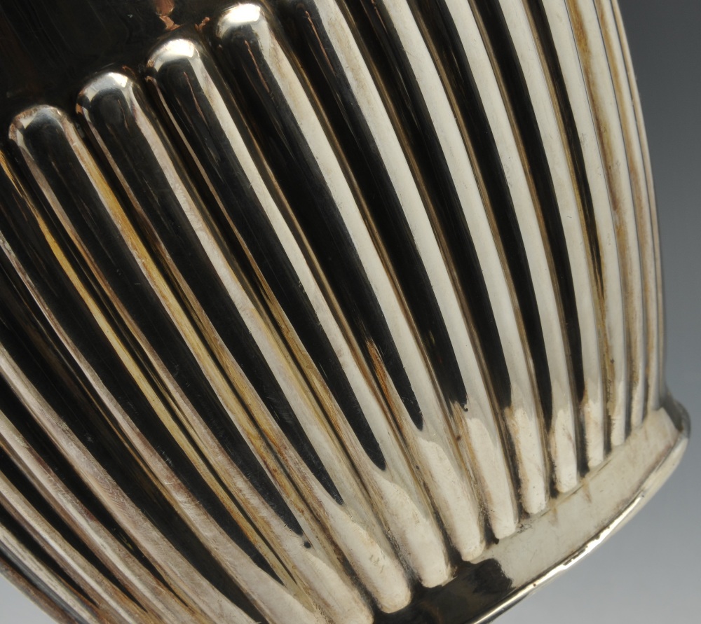 A 1920's silver teapot, of oval outline and part reeded form with applied ebonised handle and - Image 3 of 4