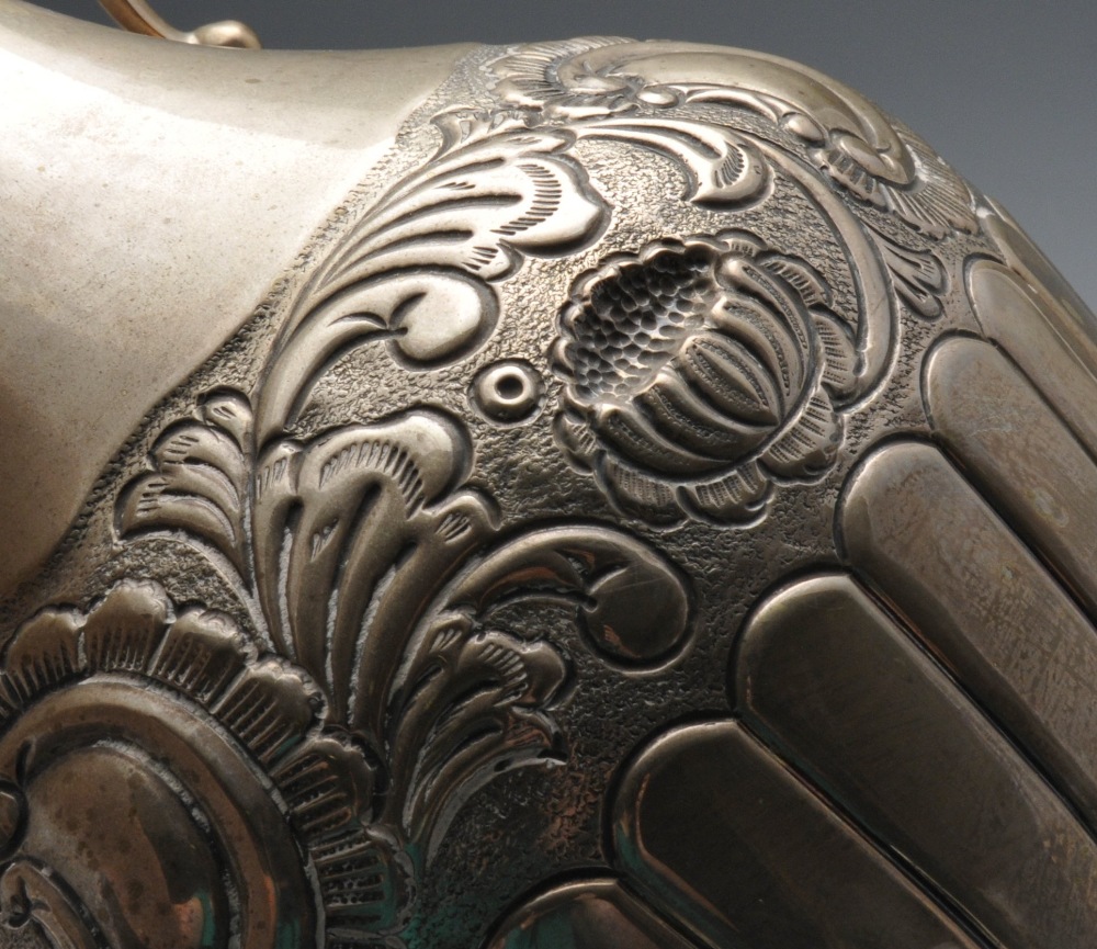 A Continental silver jug, of part fluted baluster form embossed with floral bands. Marked beneath - Image 3 of 5