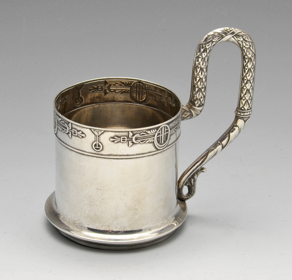 An early twentieth century Russian silver tea glass holder of cylindrical form with flared foot,