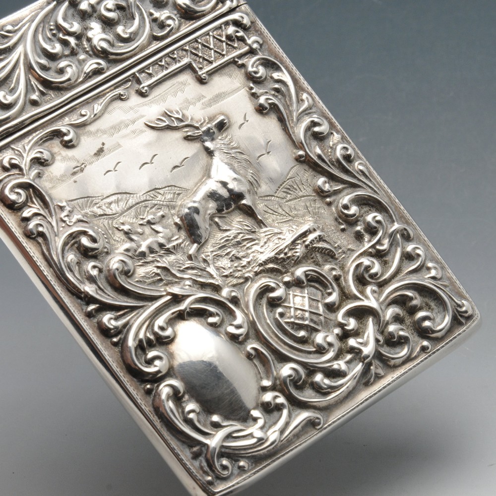 An Edwardian silver card case, the oblong form, embossed with a hillside scene of a stag and deer - Image 3 of 5