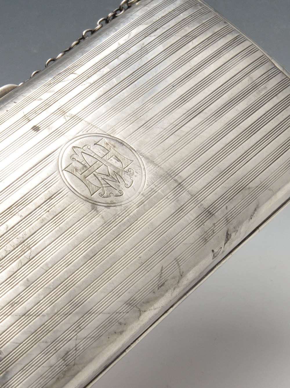 An early twentieth century silver purse or case, the oblong hinged form with reeded decoration, - Image 3 of 5