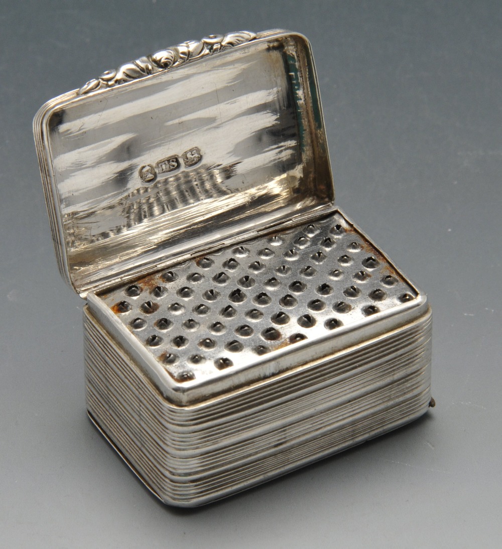 A George IV silver nutmeg grater, the oblong reeded form with dual hinges, crested cartouche and - Image 2 of 5