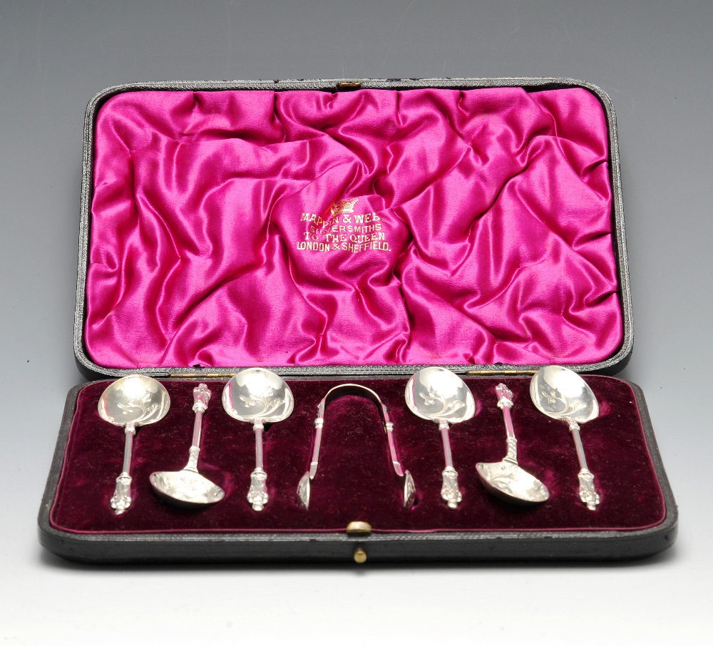 A cased set of six late Victorian silver spoons and sugar tongs having apostle terminals and foliate