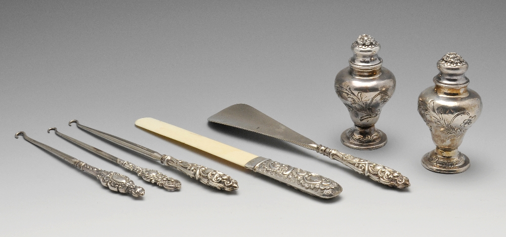 A selection of assorted Victorian and later silver items, to include three button hooks, a letter