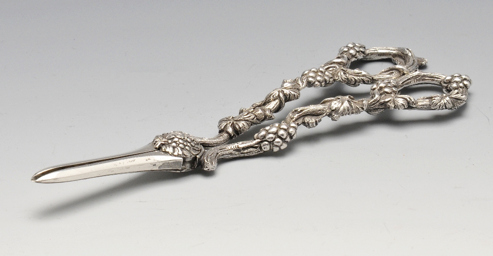 A pair of Victorian silver grape scissors, ornately decorated throughout with trailing and