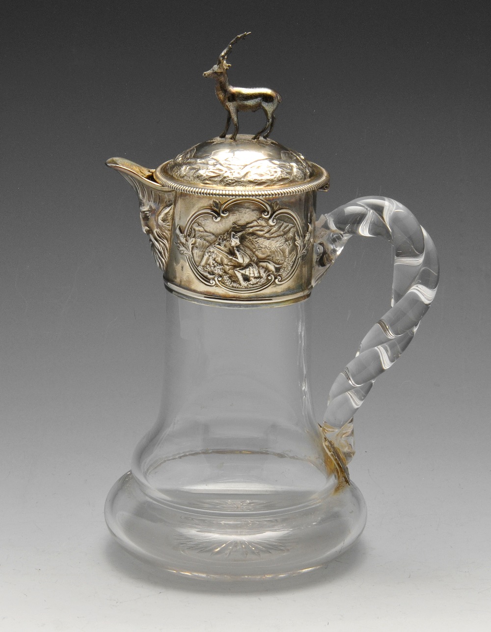 A Victorian silver mounted glass claret jug, of cylindrical form with a bulbous base and rope