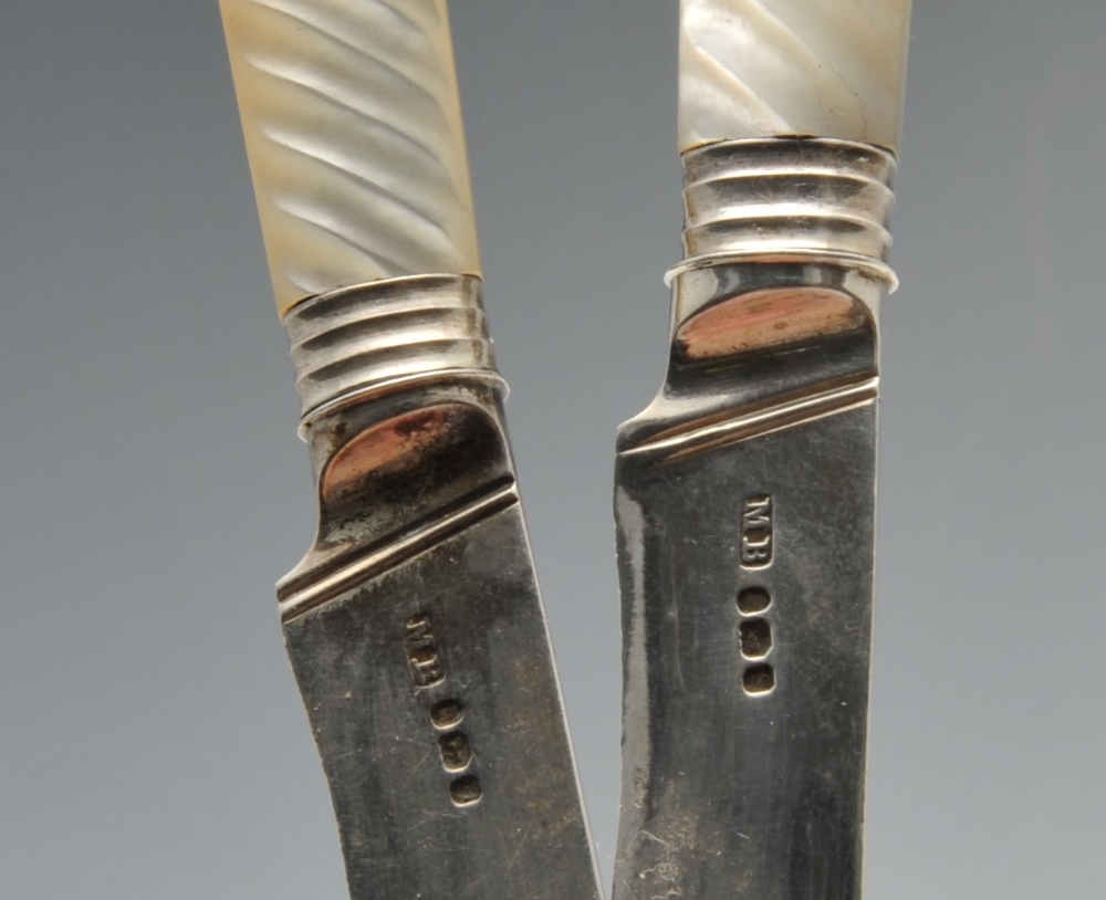 A cased composite set of twelve Georgian knives, having reeded mother-of-pearl mounted handles and - Image 2 of 3