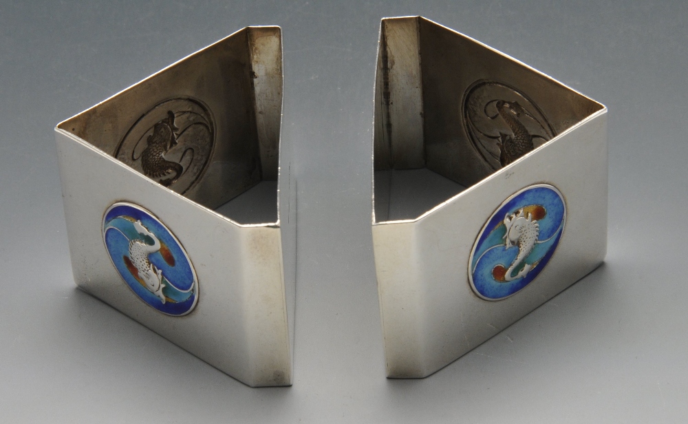 A pair of Edwardian silver napkin rings, each of triangular form and decorated with two blue and - Image 4 of 4