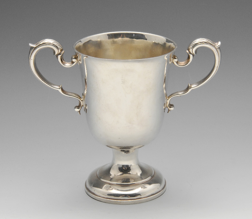 A William IV Irish silver cup of classic plain form and foliate capped twin handles. Hallmarked