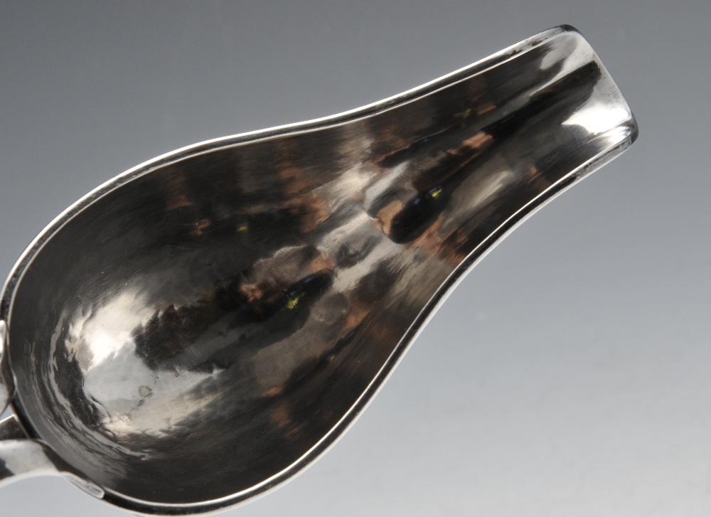 An Italian silver sauce boat of planished form with moulded rim, split loop handle and raised on - Image 3 of 5