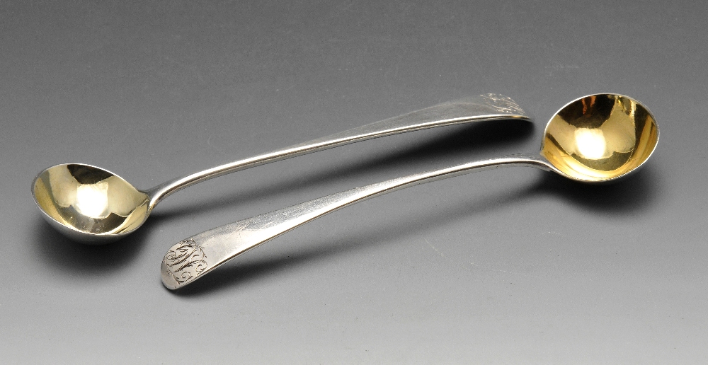 A pair of George III silver condiment spoons, having initialled terminals and gilt bowls. Hallmarked