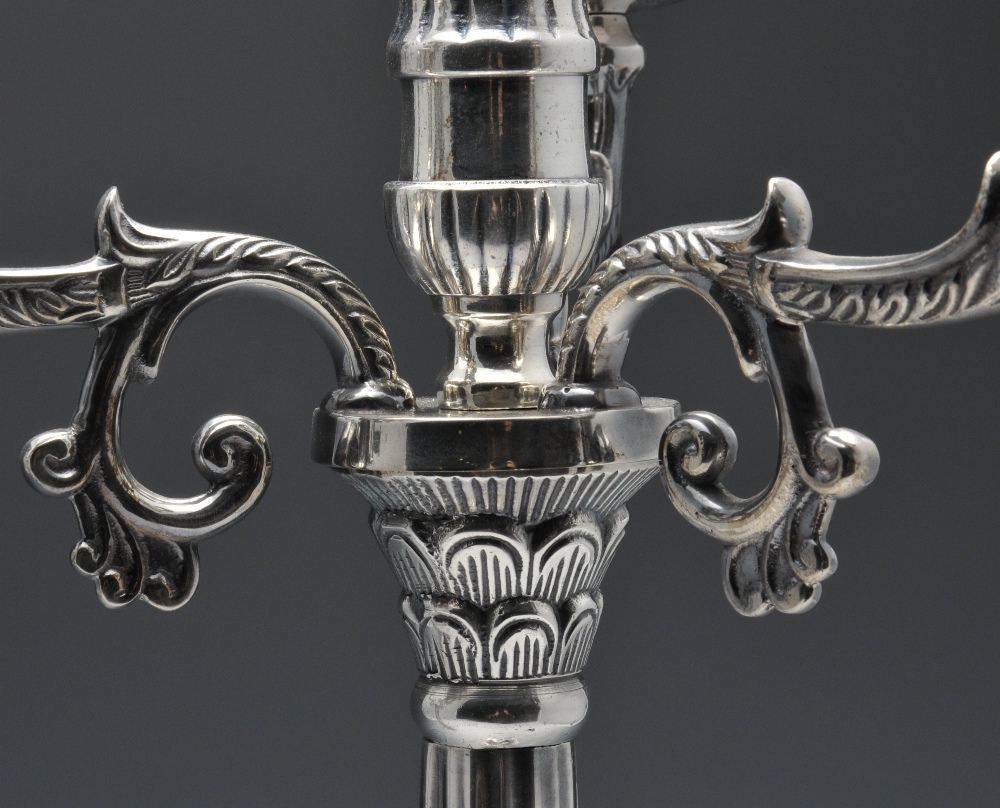 A pair of modern silver plated candelabra of Empire style, the tri-form base rising to the foliate - Image 3 of 4