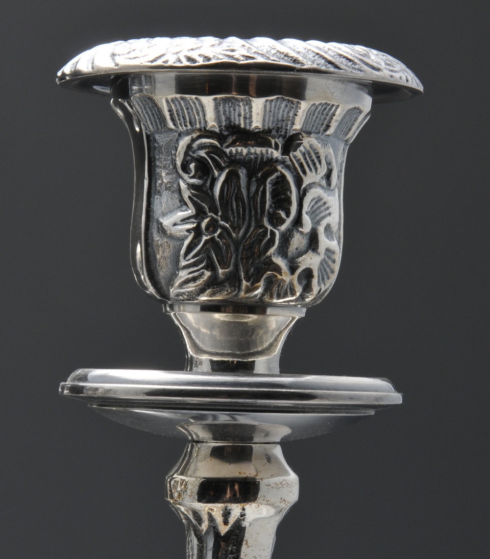 A pair of modern silver plated candelabra of Empire style, the tri-form base rising to the foliate - Image 4 of 4