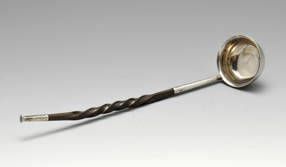 A mid-Victorian silver toddy ladle, having a spiral twist baleen handle leading to a circular bowl