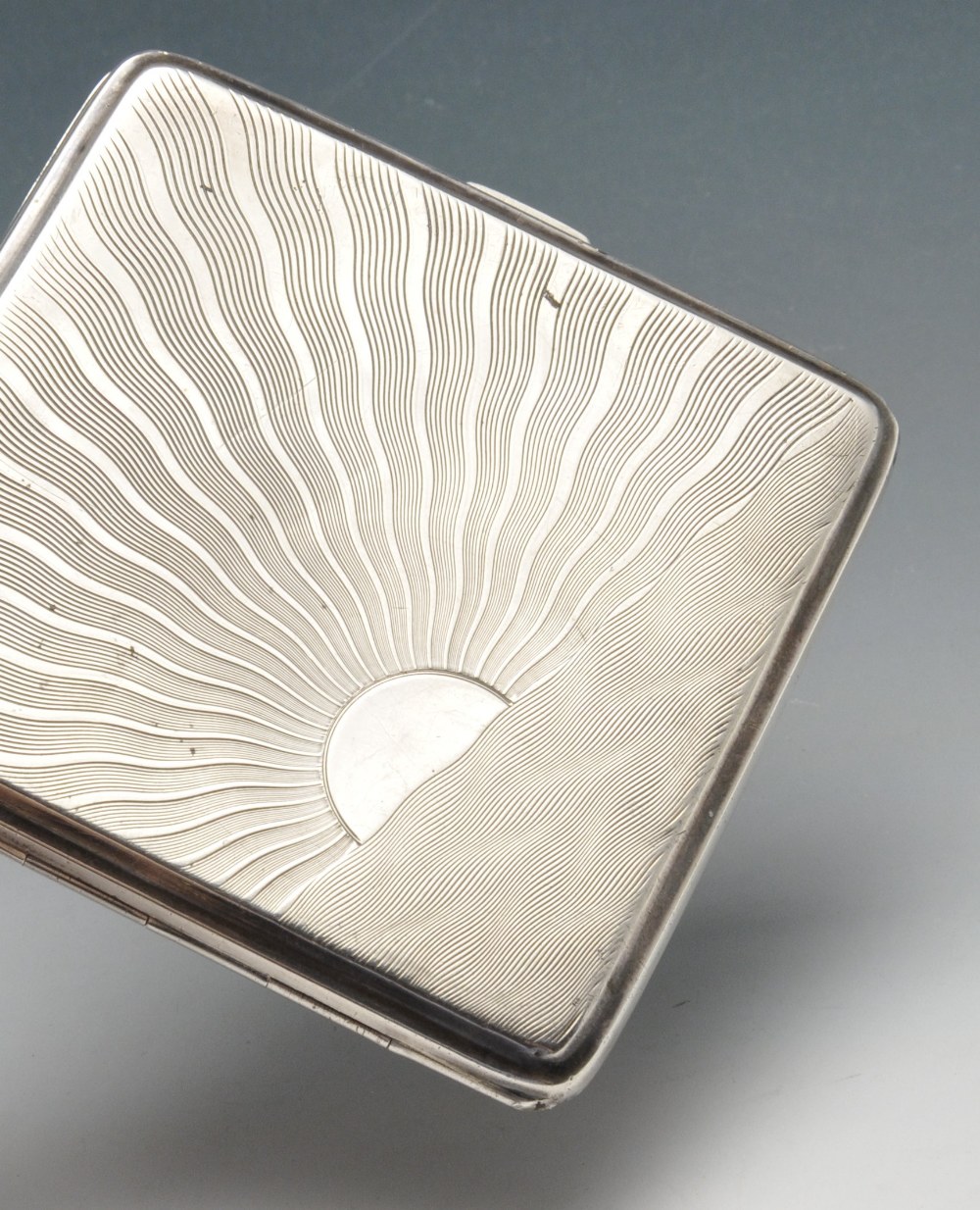 A 1930's silver cigarette case of square form decorated with radiating sun view to the exterior - Image 4 of 7