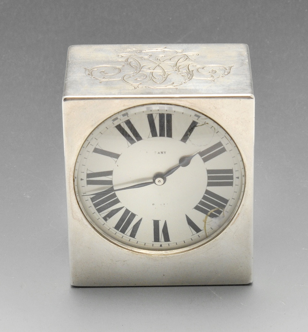 A French silver cased bedside clock, the white enamel dial signed Tiffany Paris, with black Roman