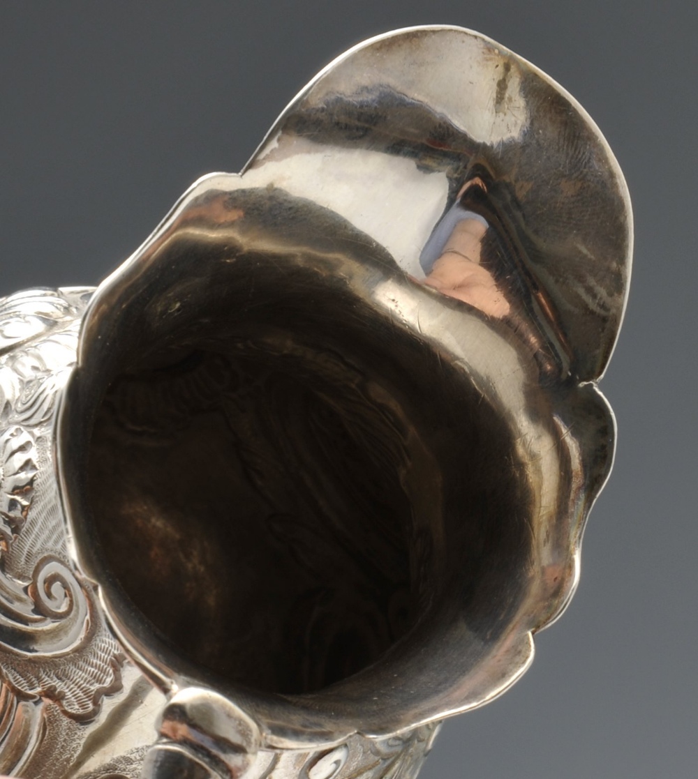 A George II silver cream jug, of globular form having waisted neck and shaped rim, decorated with - Image 5 of 9