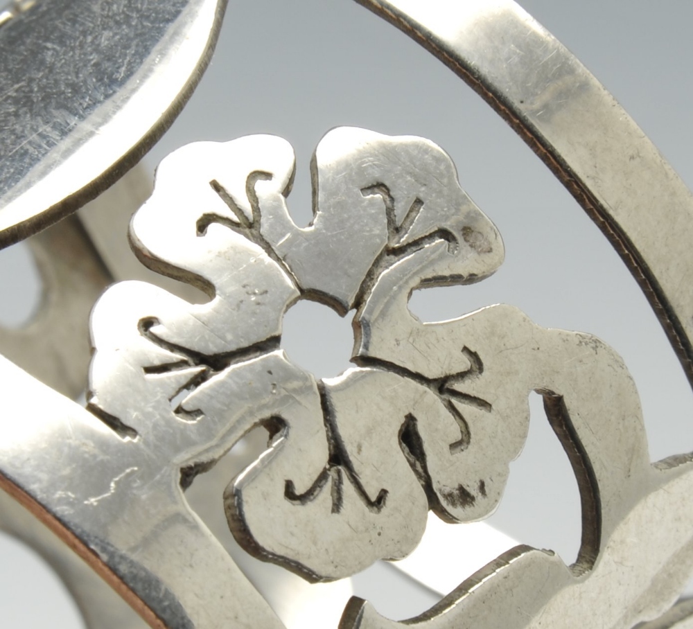 A set of three silver napkin rings of pierced circular form and decorated with stylised floral - Image 3 of 11