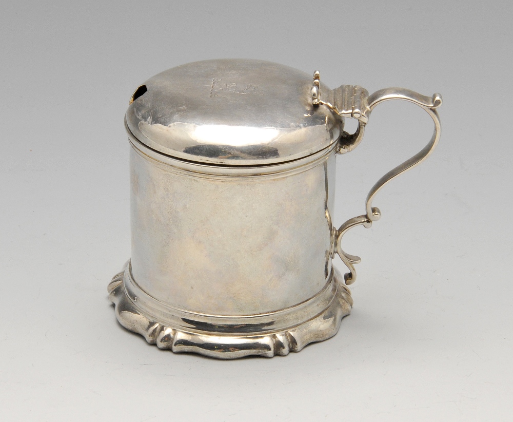 A Victorian silver mustard pot, the plain cylindrical form on fluted spread foot rising to the domed