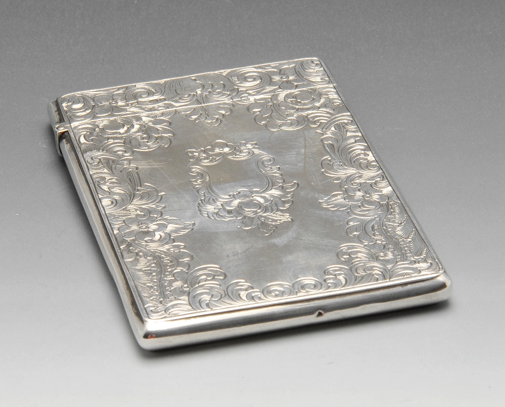 An early Victorian silver card case, the oblong form encased with floral scroll engraving and