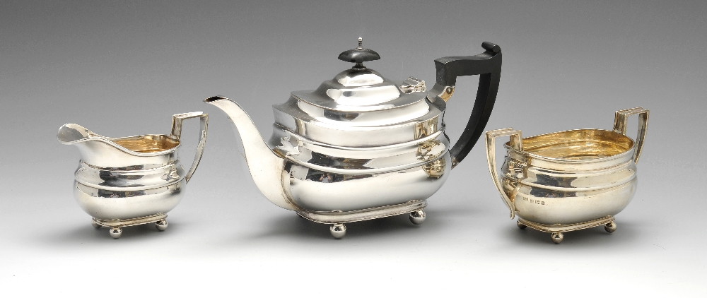 A 1930's three piece silver tea service, comprising teapot milk jug and twin handled sugar bowl,