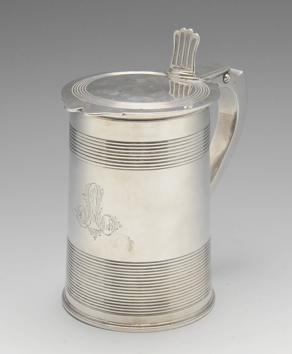 A George III silver tankard, the slightly tapering form decorated with ribbed banding enclosing an