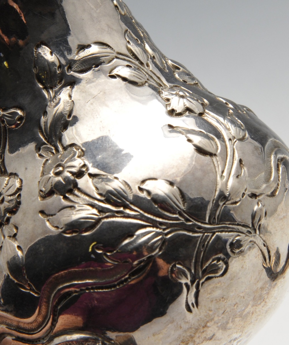 A George III silver cream jug, the bellied form with oblique fluting and beading amidst floral - Image 3 of 5