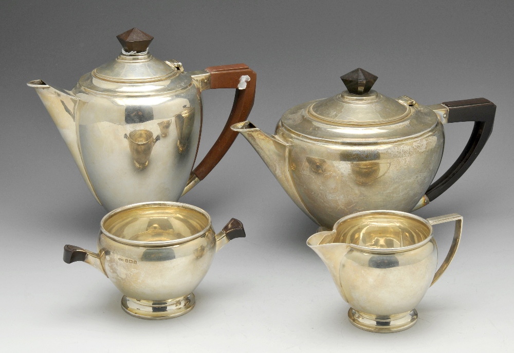 A mid-twentieth century four piece silver tea service, each with Art Deco style accents and of plain