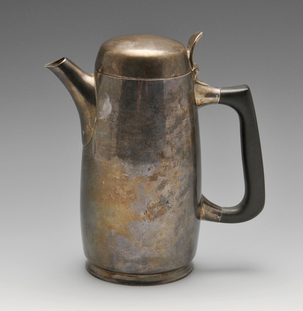 A 1960's silver hot water pot by Chesterfield College Of Art, the plain slightly tapered body with