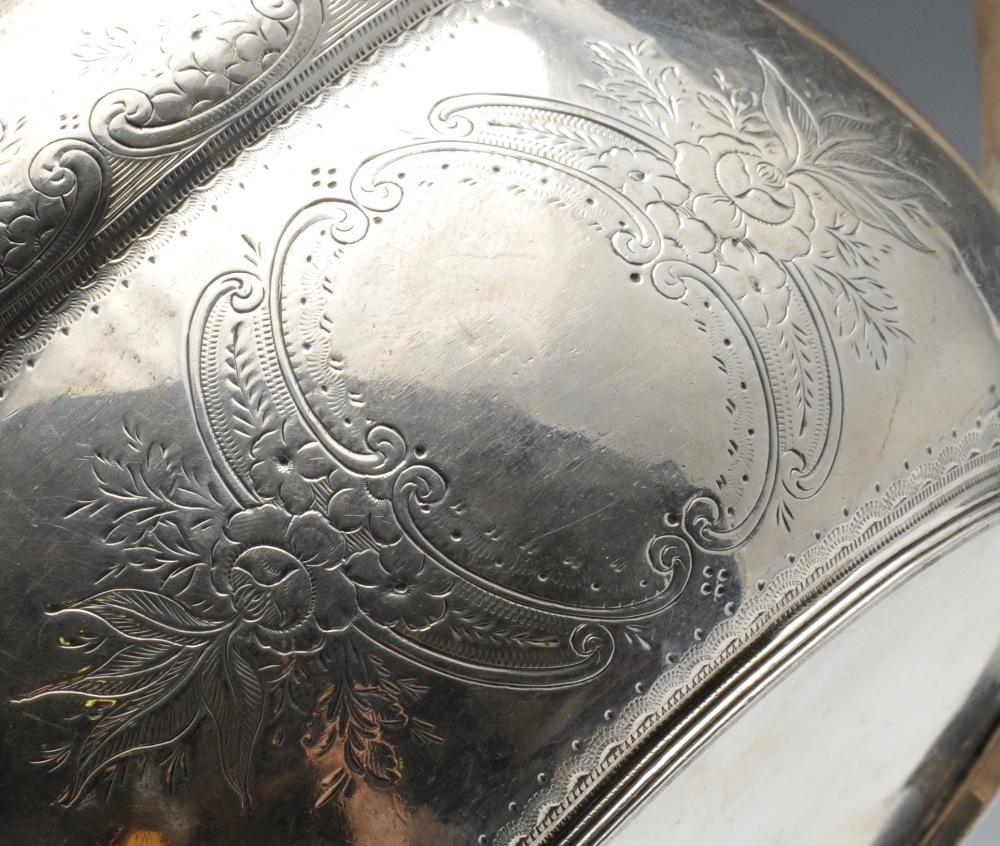 A Victorian silver teapot of oval form, the shaped body embellished with bright-cut floral scroll - Image 2 of 6