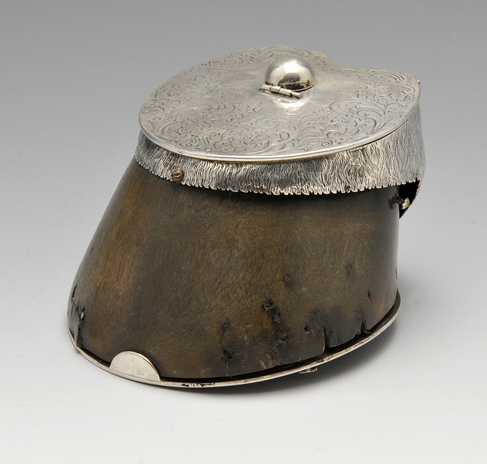 An early Victorian silver mounted hoof inkwell, the hinged lid engraved with floral motifs and