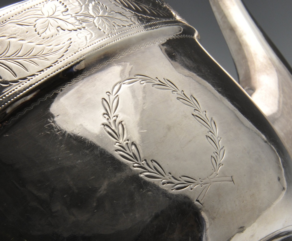 A George III silver three piece silver tea service, the oval form engraved with foliate fruiting - Image 3 of 7